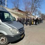 Citizens lining up for supplies outside the church in Chernihiv
